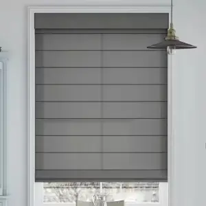 Elegant fabric Roman shades with clean pleated folds installed on a living room window.